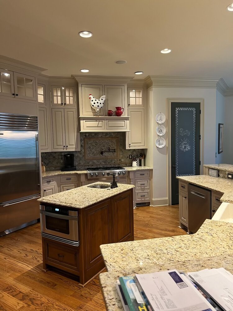 before of kitchen with small island and tan countertops