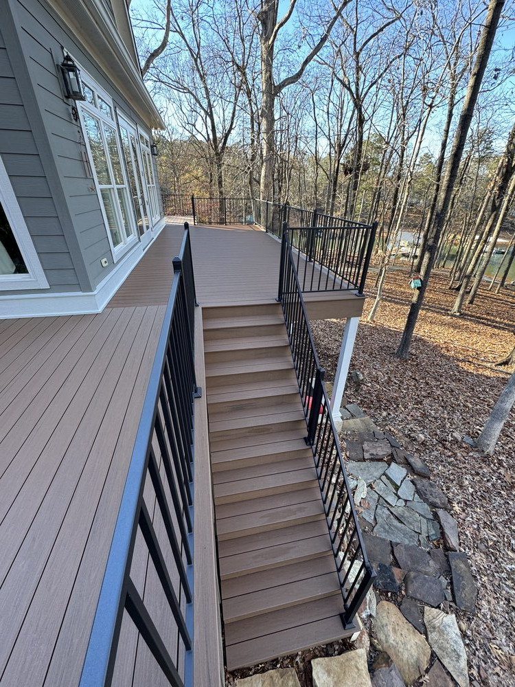 large newly built top deck has new sleek black metal railing all around the deck, allowing for wonderful lake views