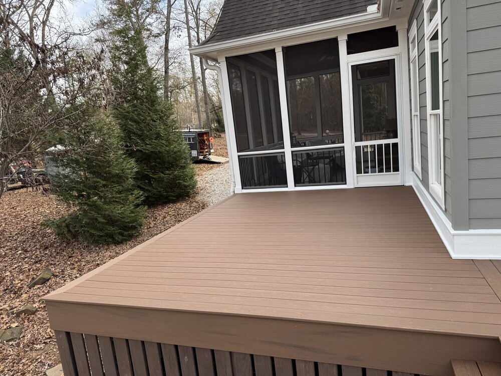 newly laid deck in corner of house