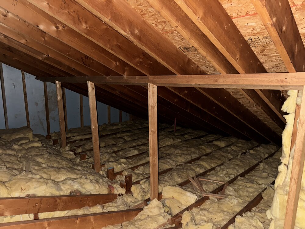 before of unused attic full of insulation