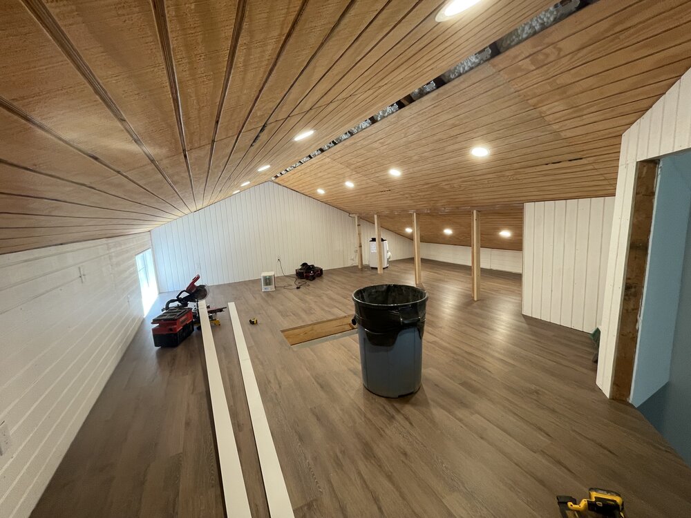 remodel is almost complete with attic ceiling displaying beautiful wood paneling and recessed lighting