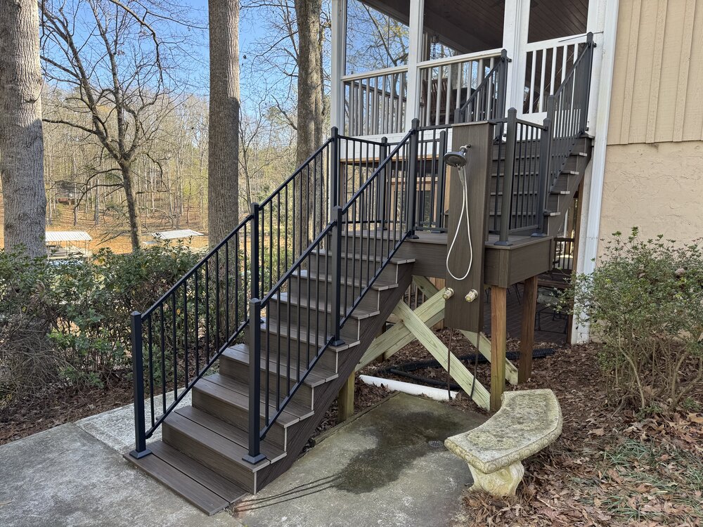 newly built stairway with 12 stairs now has sleek black metal railing