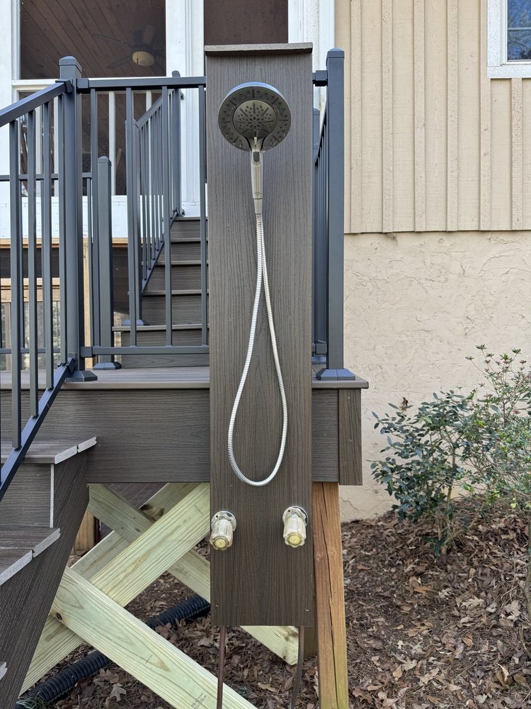 large newly built top deck has new sleek black metal railing all around the deck, allowing for wonderful lake views
