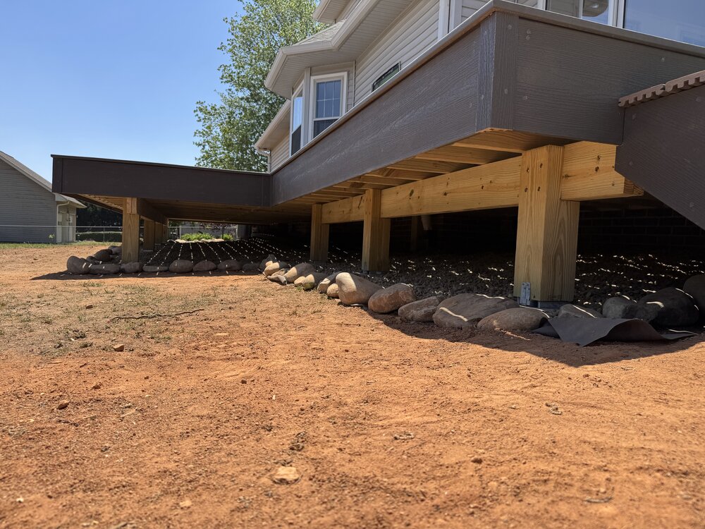 View from the ground of underneath the finished cantilever deck.