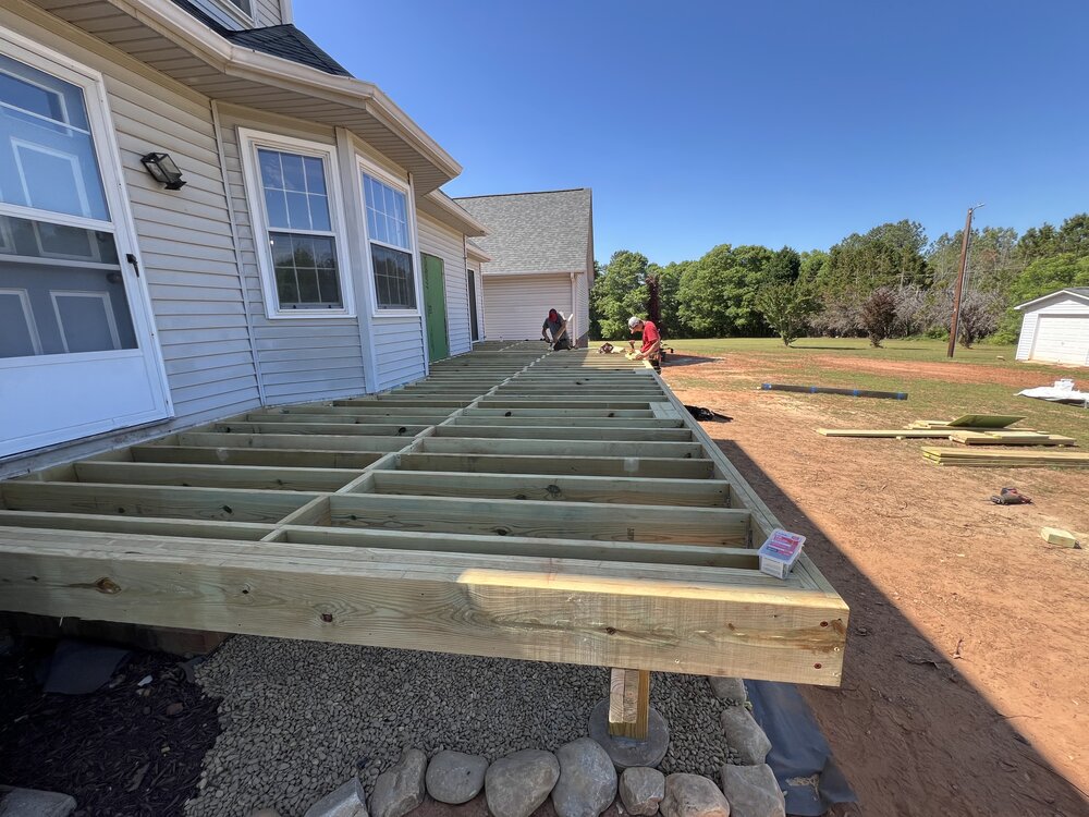 Filling in the framing of the deck construction.